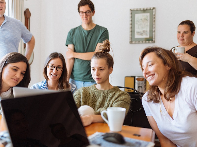 people-looking-at-laptop-computer-1595391