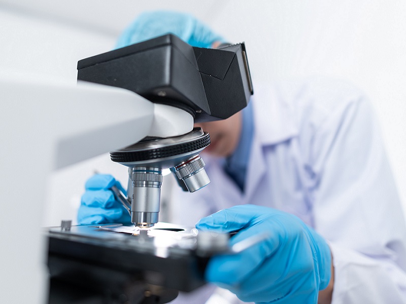 scientist-using-microscope-3938022