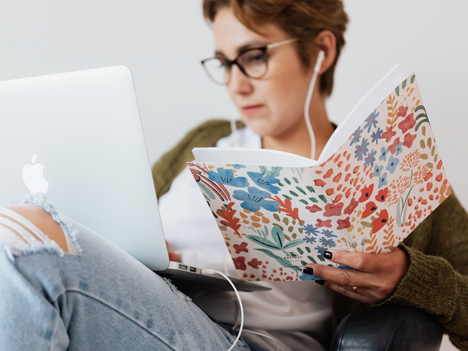 serious-woman-using-laptop-while-listening-to-music-in-4468087