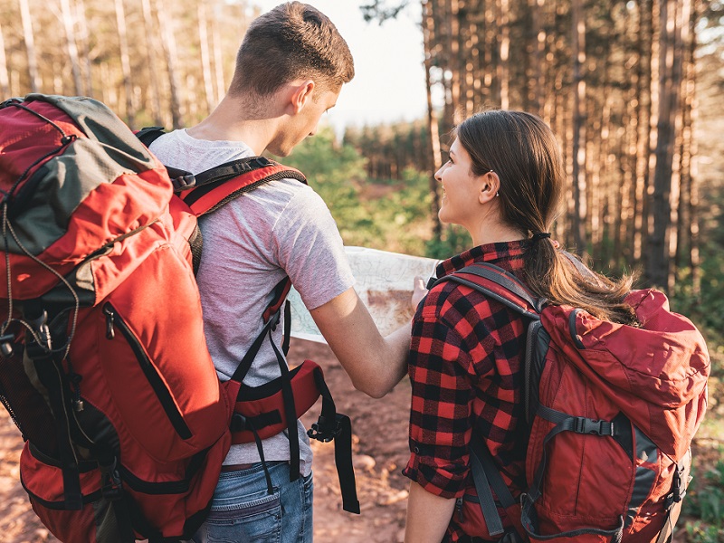 travelling or hiking with map looking for directions(iStock-1014182128)