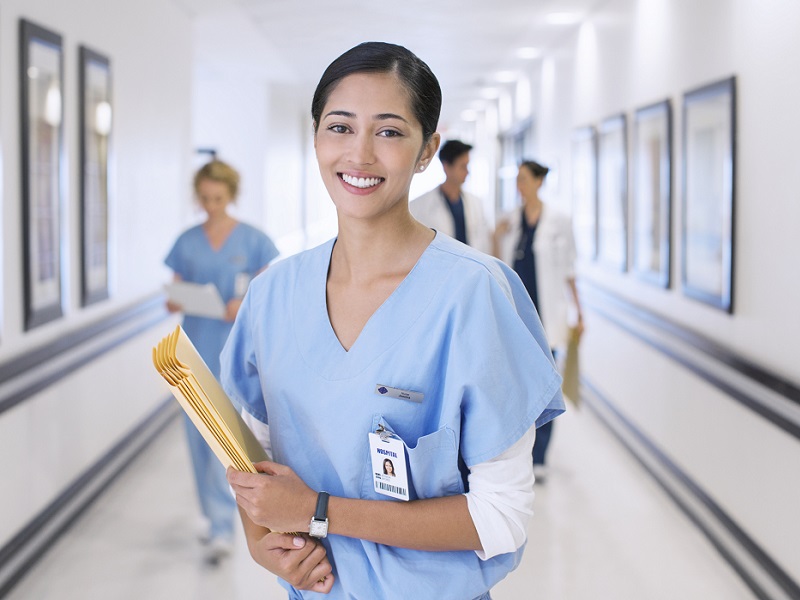 young doctor in scrubs (GettyImages-184312638)