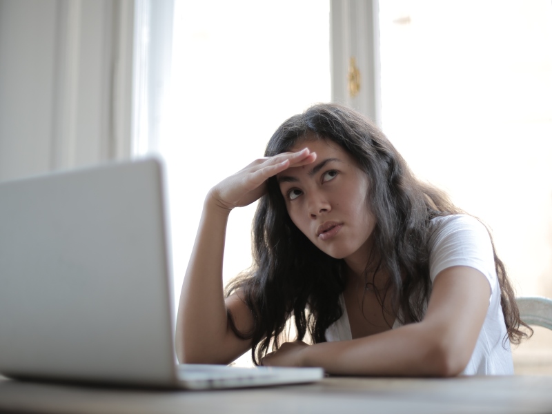 young-annoyed-female-freelancer-using-laptop-at-home-3808008